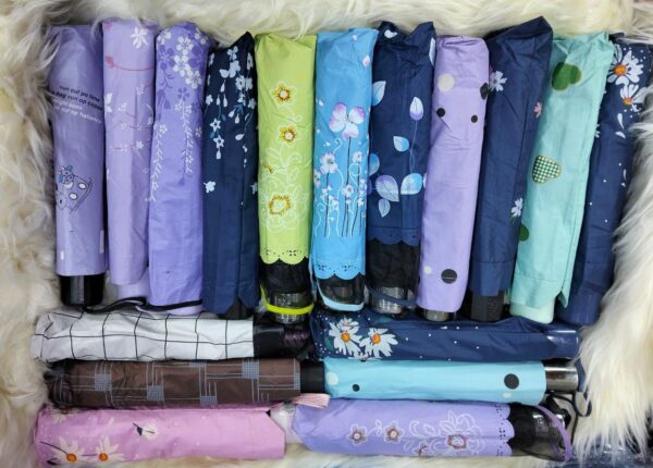 *3 fold umbrella* Strong fabric, Comes in a variety of patterns.