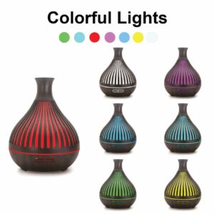 Wood grain, vase-style ultrasonic aroma diffuser with integrated color-changing LED lighting.